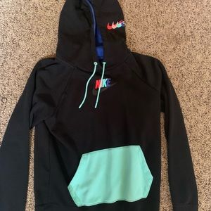 Black Nike hoodie with colorful pocket and Nike sign